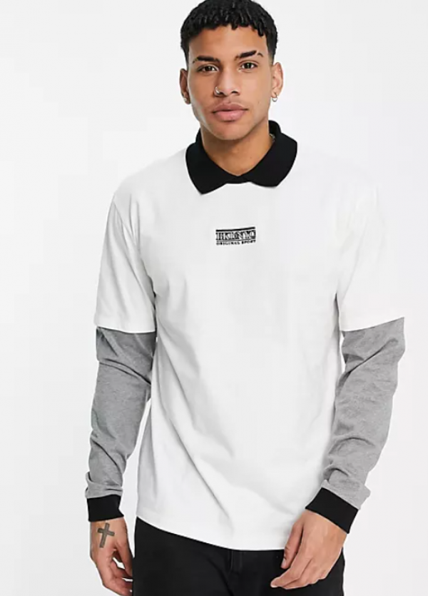 Kemeja dengan desain berlapis di bagian dada